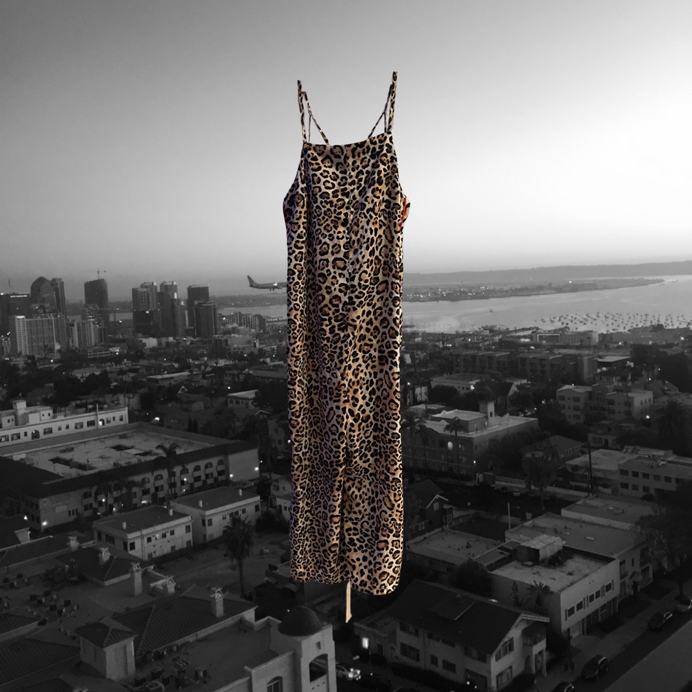 XS Topshop leopard print romper. Wide legged, with a red running stripe.